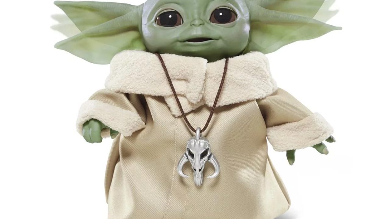 Premium Photo  A close up of a baby yoda with a hood and large blue eyes.